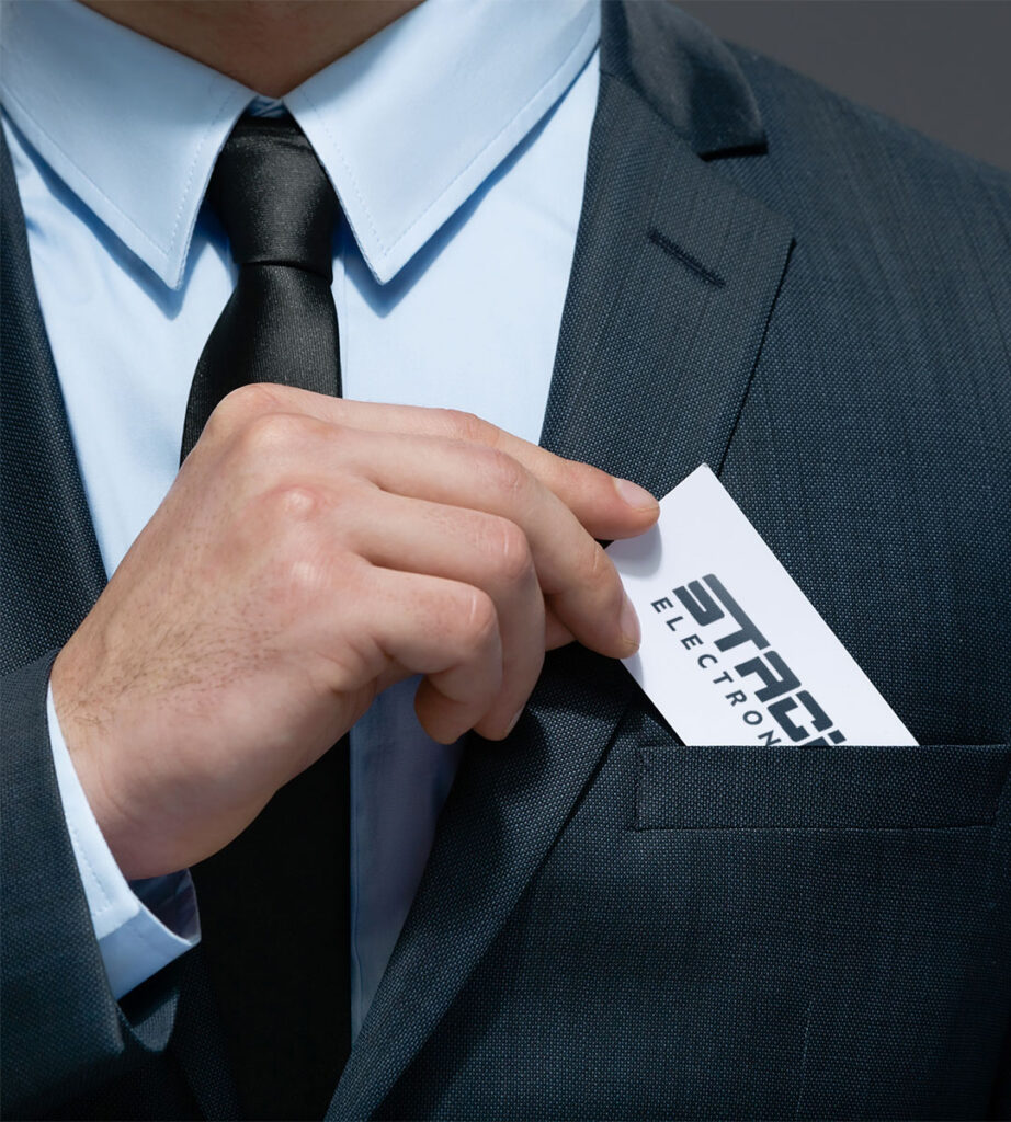 Man in suit pulling business card out of pocket